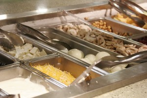The vegetables featured in the salad bar at a campus dining hall.